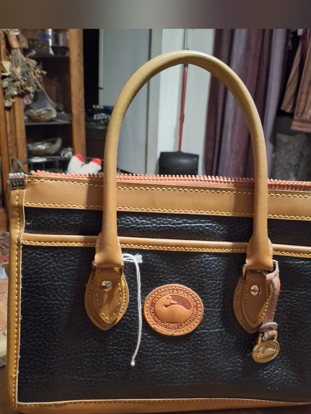 Dooney & Bourke Black Leather Satchel with Tan Logo Patch